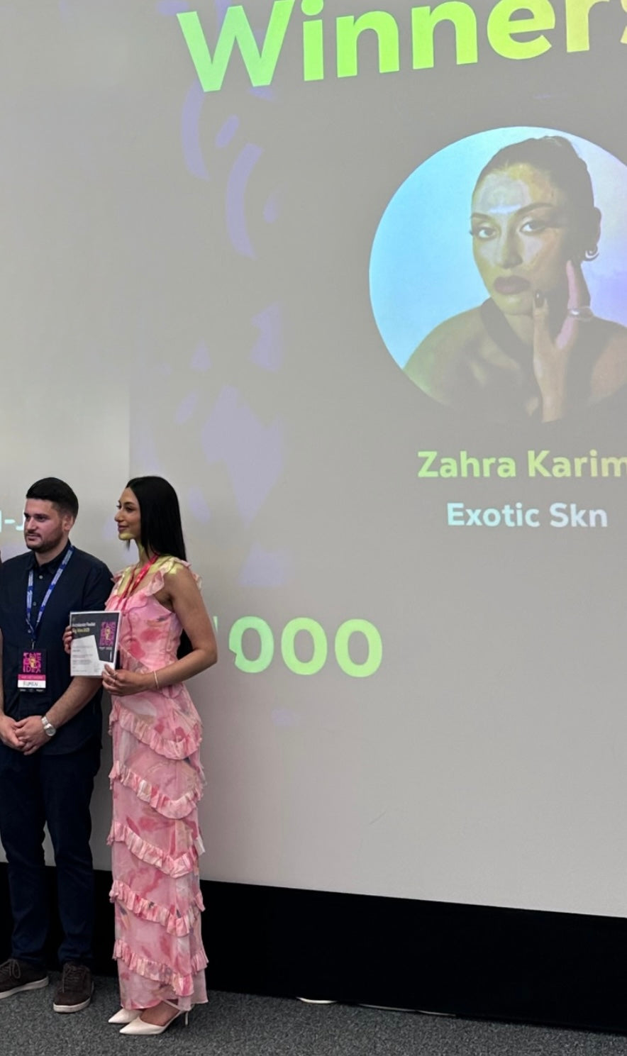 Zahra Karim holding her first-place Big Idea Competition award