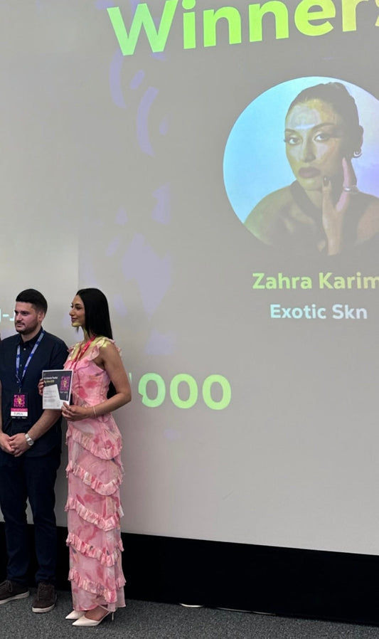 Zahra Karim holding her first-place Big Idea Competition award